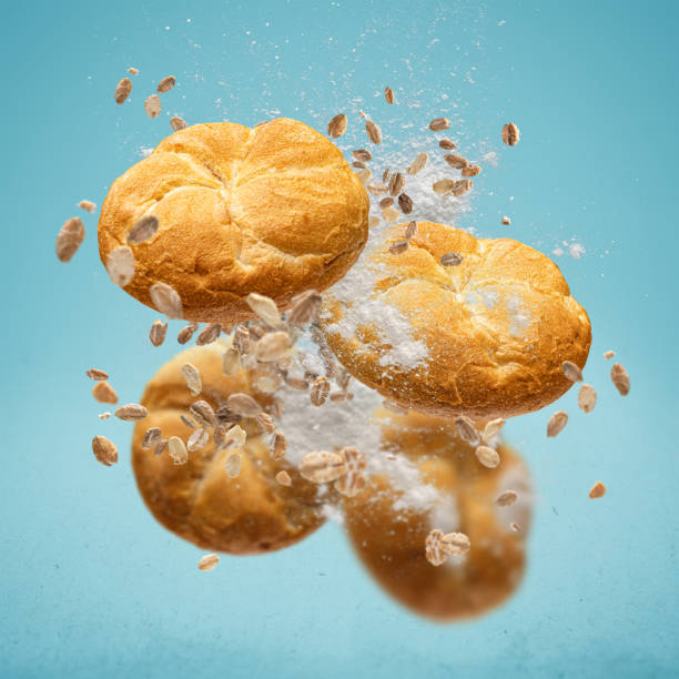 istock Delicious buns flying in air 1387047334