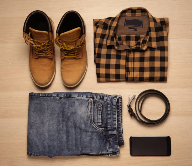istock Flat lay composition with stylish clothes and accessories on wooden background 1387047421