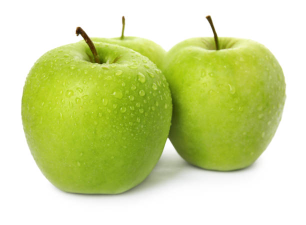 istock Fresh ripe green apples with water drops isolated on white 1387048268