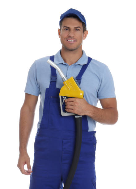 istock Gas station worker with fuel nozzle on white background 1387048467