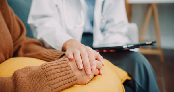 Asian woman psychotherapist Doctor talking with the patient about mental health, for recover wellbeing and be a healthy lifestyle. Asian woman psychotherapist Doctor talking with the patient about mental health, for recover wellbeing and be a healthy lifestyle. Close up shot. nervous holding hands stock pictures, royalty-free photos & images