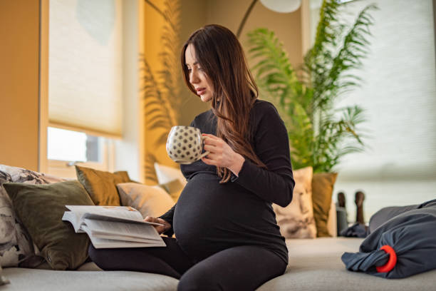 Free Stock Photo of Beautiful pregnant woman with a cup sitting in the ...