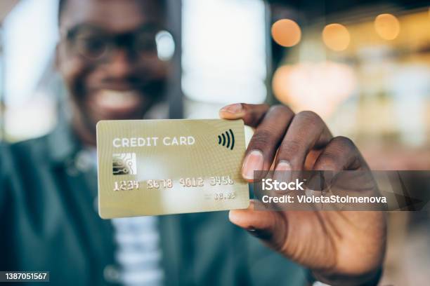 Man Holding A Credit Card Stock Photo - Download Image Now - Credit Card, Human Hand, Men