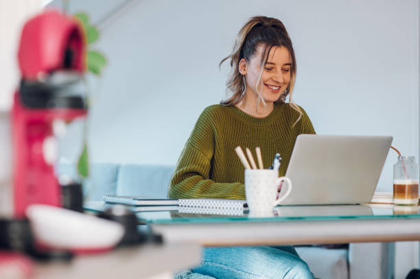 istock Woman working from a home on her a laptop 1387051696