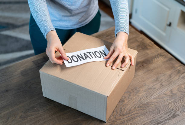 istock People preparing a food box for donation 1387052656