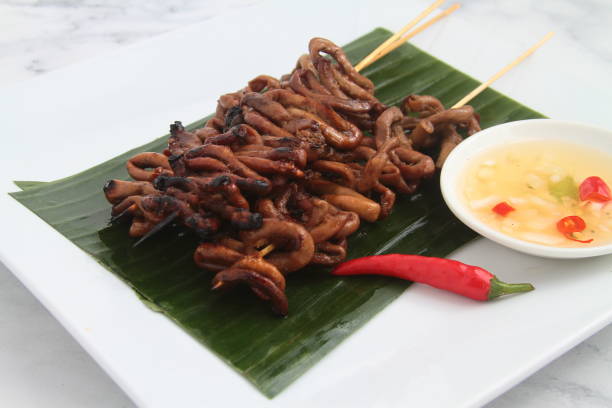 istock Freshly cooked Filipino food called Isaw manok 1387053154