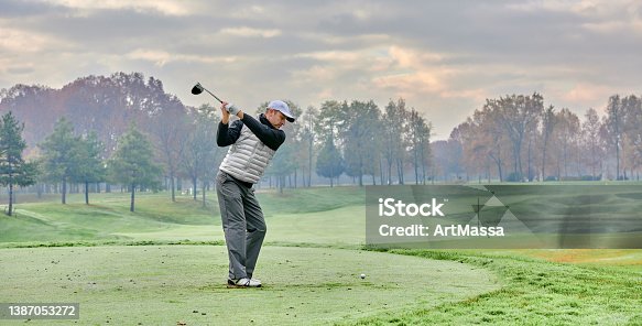 https://media.istockphoto.com/id/1387053272/photo/golfer-on-a-golf-course-in-winter-with-fog-and-frost-on-the-starting-tee-golfer-with-golf.jpg?s=170667a&w=is&k=20&c=pWFYWJY_UrXGTMqmiFd2gfyGGAZwecdzTsGVtN1ub8E=