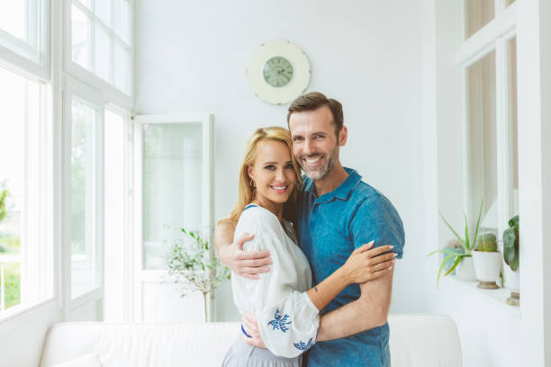 istock Happy couple standing at home 1387054414