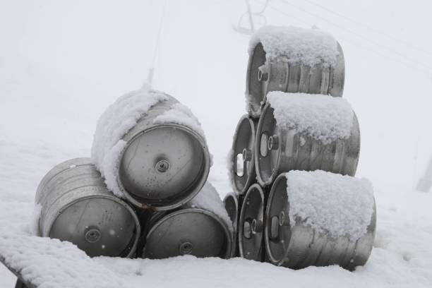 istock Some beer barrels stacked in the snow 1387054424