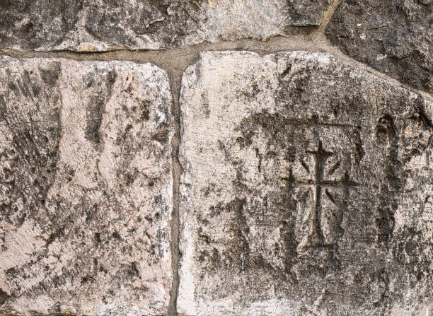 istock Christian symbol scratched on an ancient wall. 1387055351