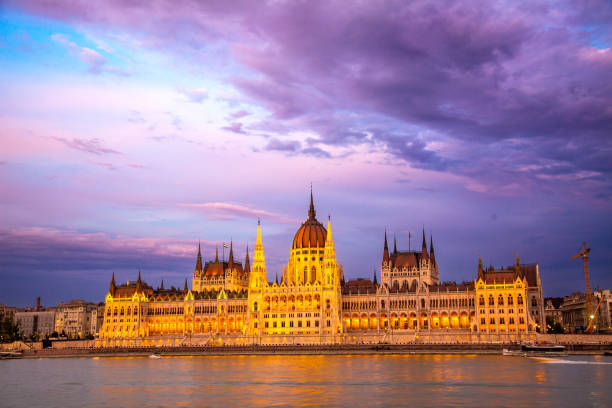 Hungarian parliament at night. Dramatic sky on the background. View from the Buda castle.