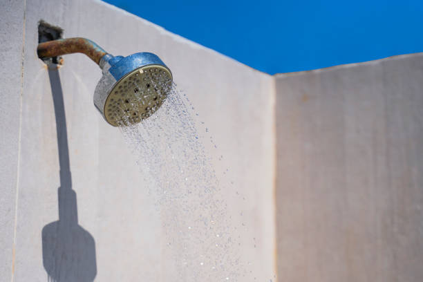 istock Shower with running water against the blue sky on the beach. 1387057251