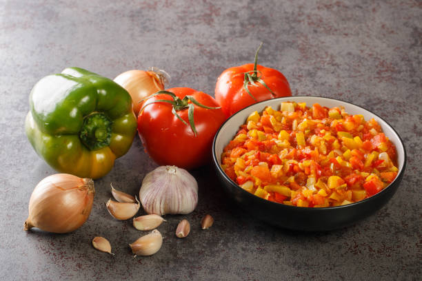 Homemade fresh sofrito sauce from summer vegetables close-up in a bowl. horizontal Homemade fresh sofrito sauce from summer vegetables close-up in a bowl on the table. horizontal puerto rican culture stock pictures, royalty-free photos & images