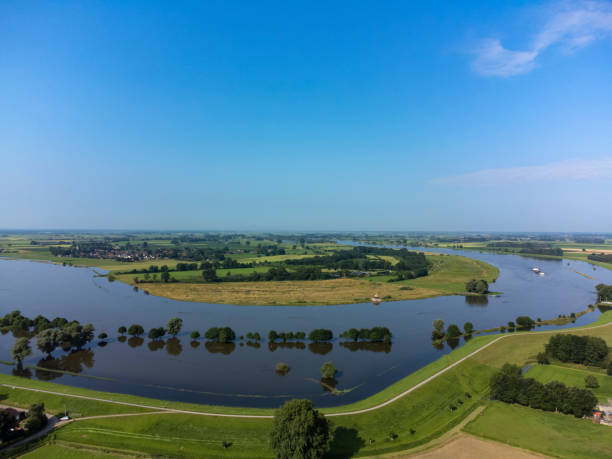 istock Ship on the river IJssel with high water level on the floodplains 1387060700