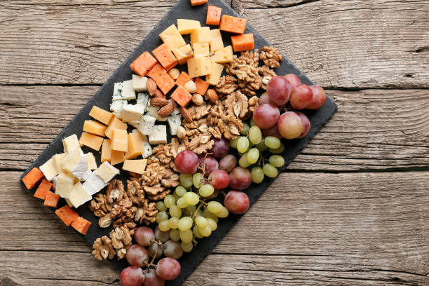 istock Cheese plate with variety of appetizers on table 1387061545