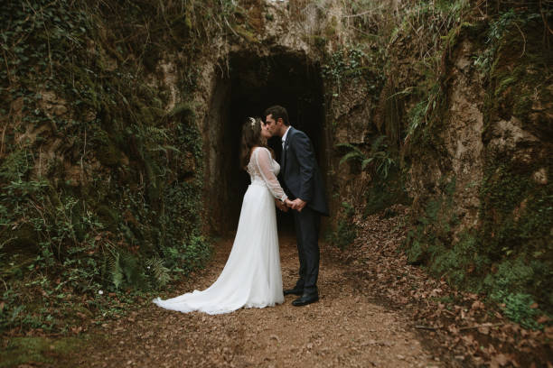 istock Just married couple kissing 1387063828