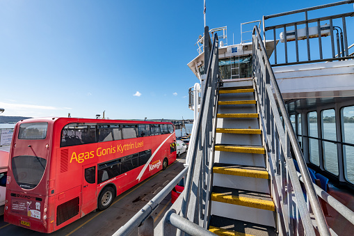 Double decker bus on a ferry from Plymouth to Torpoint in Devon. Steps to upper deck.