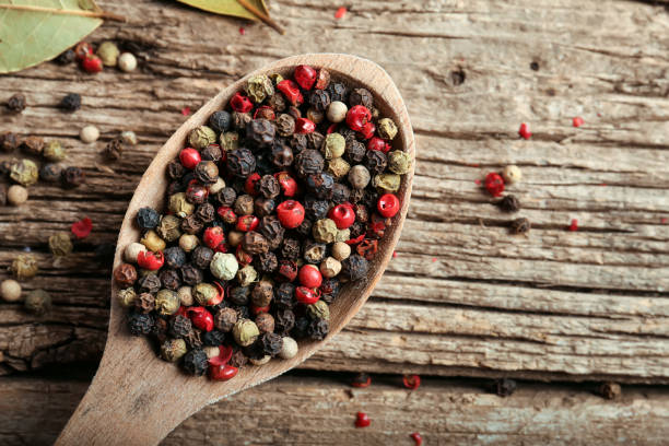 istock Pepper peas on wooden background 1387065262