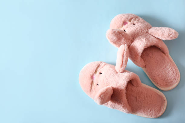 istock women's slippers and towels on a blue background 1387066322