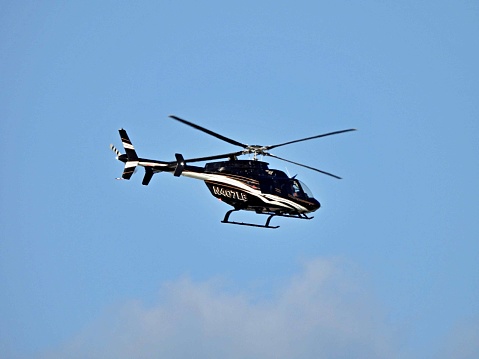 Boca Raton, Palm Beach County, Florida, USA. March 21, 2022. A helicopter (7 seats / 1 engine) ) is taking off from the Boca Raton Airport. N407LB