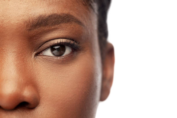 close up of face of young african american woman stock photo