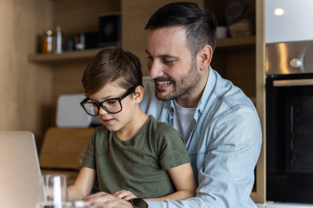 istock Father and son having their time in home envrioment 1387068579