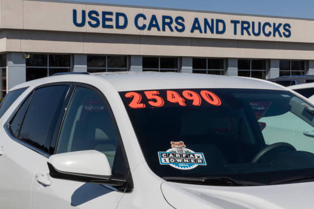 Carfax sticker on a used pre-owned vehicle. Carfax provides vehicle reports for prospective buyers that may reveal problems. stock photo