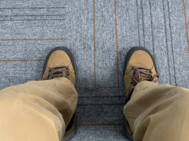 istock Men Wear Hiking Boot Sitting in Home 1387071901