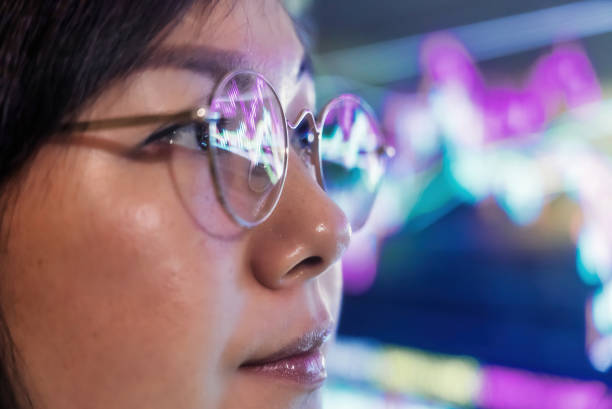 istock Stock Market Graph Reflection on eyeglasses 1387072660