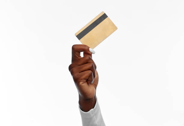 hand of african american woman with credit card stock photo