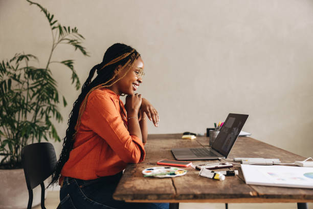 istock Happy graphic designer attending a virtual meeting 1387073436