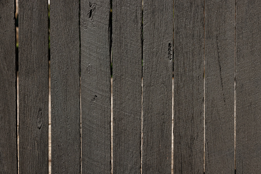 Wooden fence darkened over time.
