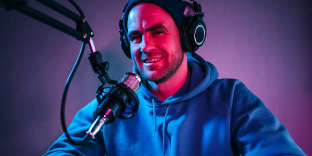 istock Cheerful streamer  broadcasting his audio show 1387076187