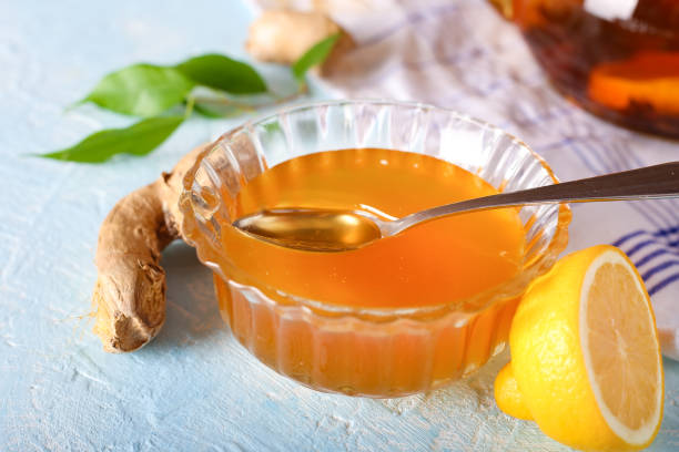 istock Tea, lemon, honey and ginger healthy on the light background 1387076376
