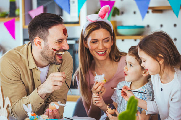 istock Happy family spending Easter together in the kitchen 1387076530
