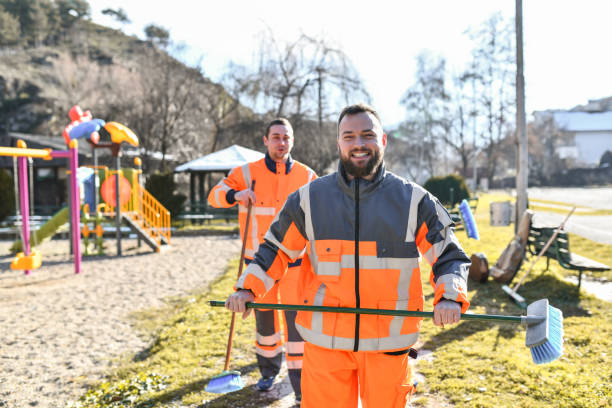 istock Male Sanitation Workers Confidently Doing Their Job 1387078449