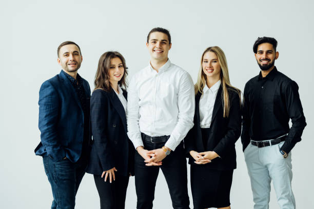 istock Group of leading experts standing in the office . 1387080848