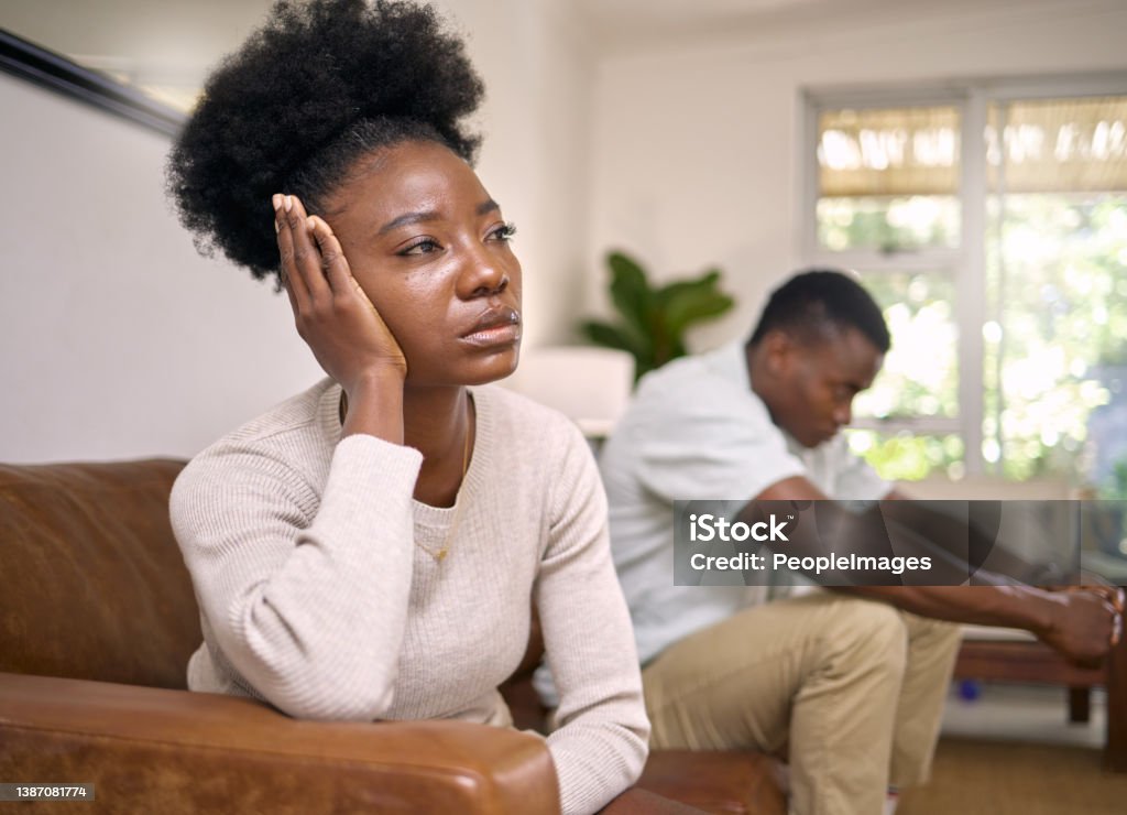 Shot of a young couple in an argument at home Where do we go from here? Couple - Relationship Stock Photo
