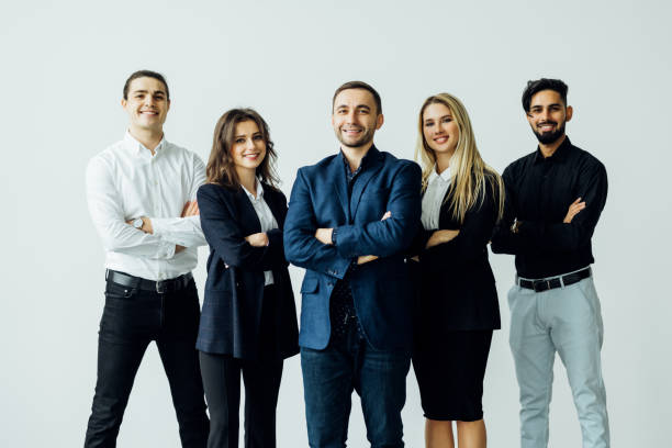 istock Group of leading experts standing in the office . 1387081977