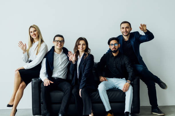 istock Business people sitting couch at home, Unity Concept 1387083214