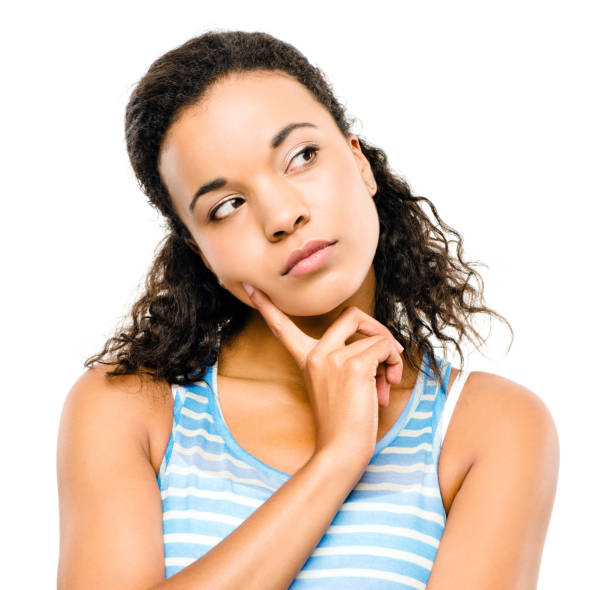 istock Shot of a young woman thinking against a studio background 1387083328