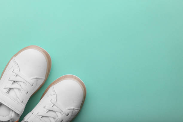 istock Baby shoes isolated on light background 1387083514