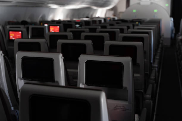 istock Rows of empty seats in airplane 1387084010