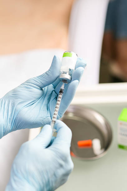 istock Medicine and syringe in hands 1387085325