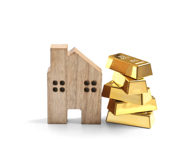 istock House and gold on isolation 1387085341