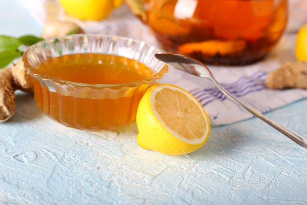 istock Tea, lemon, honey and ginger healthy on the light background 1387087158