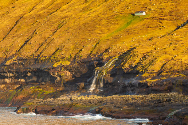 Sunset over the Faroe Islands, a volcanic archipelago in the Atlantic Ocean. Gjogv, Eysturoy island, Faroe Islands.