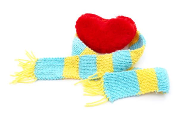 istock Red heart in a yellow and blue scarf. 1387088885