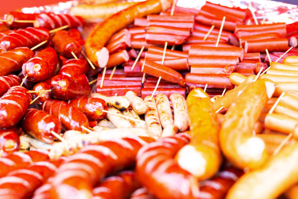 Lots of delicious fried sausages on skewers. A variety of flavors. Top view
