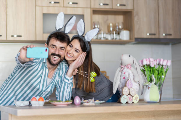 istock Beautiful young couple taking a selfie celebrating Easter 1387090799